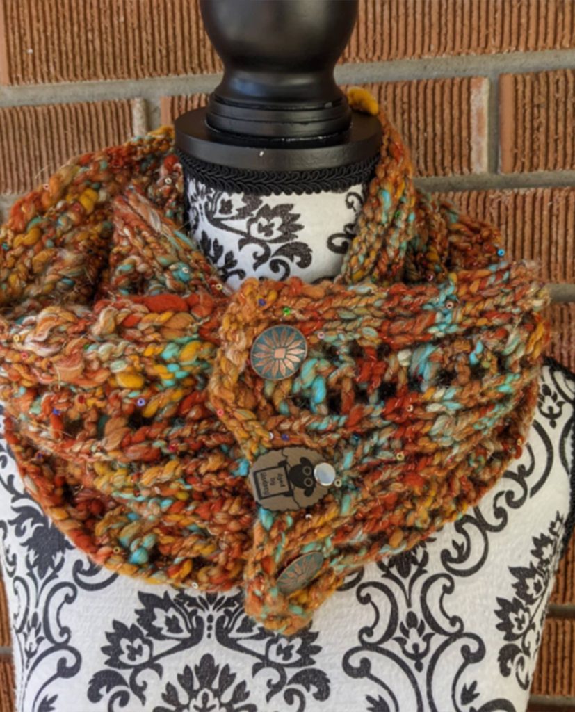 Photo of a multicoloured handknit scarf from a social media fundraiser for Myeloma Canada